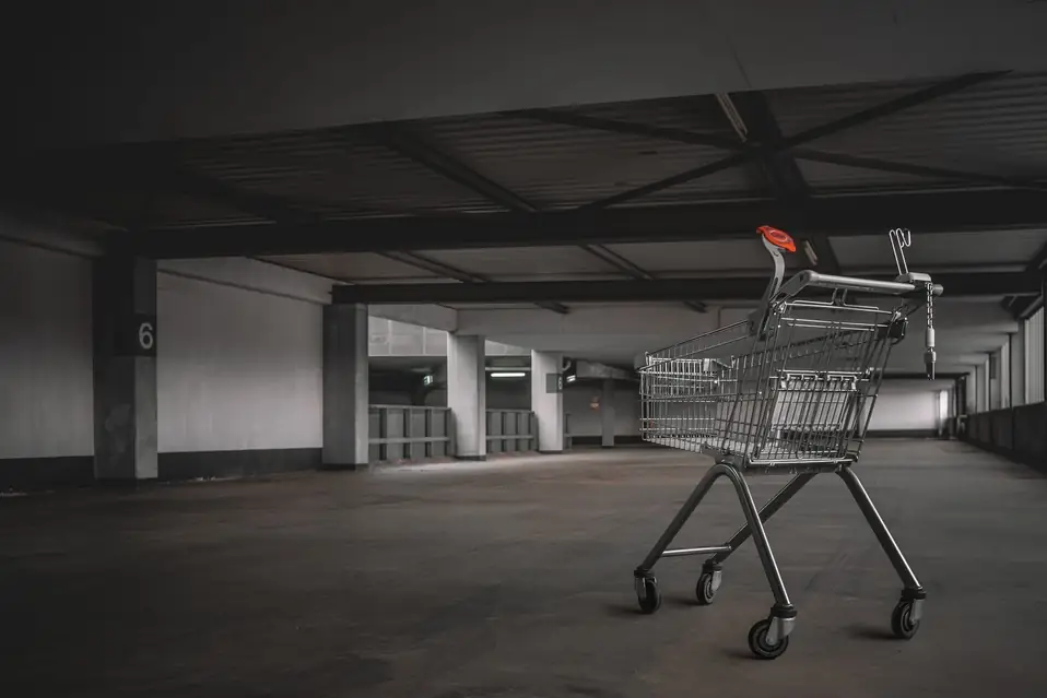 Shopify merchant reviewing checkout abandonment analytics on a laptop with funnel metrics showing add to cart and checkout starts but zero completed purchases