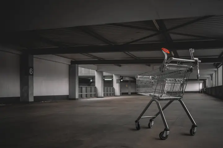 Shopify merchant reviewing checkout abandonment analytics on a laptop with funnel metrics showing add to cart and checkout starts but zero completed purchases